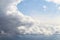 Piece of blue sky next to large clouds after rain