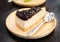 A piece blueberry cheesecake serve on the wooden plate
