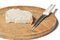 A piece of bread and a knife on a wooden board isolated on a white background