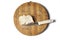 A piece of bread and a knife on a wooden board isolated on a white background