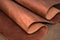 A piece of brown leather. Texture of natural material