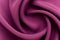A piece of burgundy, violet cloth. Fabric texture for background and design works of art, beautiful wrinkled pattern of silk
