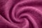 A piece of burgundy, violet, red cloth. Fabric texture for background and design works of art, beautiful wrinkled pattern of silk