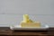 piece of butter on a wooden desk