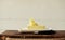 piece of butter on a wooden desk