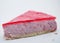 Piece of cake on white background. Cheesecake with raspberry jelly