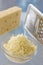 Piece of cheese and grated cheese French emental