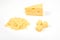 Piece of cheese and heap of grated cheese, isolated on white background.