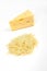 Piece of cheese and heap of grated cheese, isolated on white background.