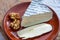 Piece of cheese tomme de chevre made from goat milk in France