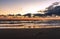 A piece of fishing rope on beach at amazing colorful dawn