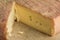 Piece of French Munster cheese closeup