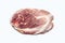 A piece of fresh pork meat on a white background.Pork tenderloin is the top view.