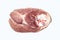 A piece of fresh pork meat on a white background.Pork tenderloin is the top view.