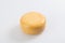 A piece of fresh processed cheese isolated on a white background