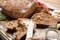 Piece of fresh tasty bread with butter on metal tray, closeup