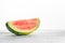 Piece of fresh watermelon on white table