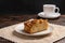 Piece of homemade traditional cornish apple pie on a white plate on the napkin. Close up. Selective focus