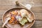 Piece of Hotdog remains on wooden plate