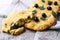 A piece of Italian bread Focaccia with olive and herbs