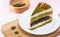 Piece of matcha red bean cake and almond decorated