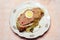 Piece of meatloaf in Savoy cabbage leaves in a beautiful vintage serving plate. half an egg in the center of the cut, a lot of