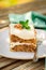 A Piece of Moist Zucchini and Walnut Cake with Cream Cheese Frosting