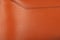 A piece of monochrome orange leather