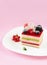 Piece of Multi-layered Berry and Pistachio Mousse Cake