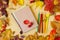 A piece of paper for records or drawing, a set of colored crayons in the framing of autumn leaves which  turn into the warm colors