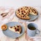 Piece of pie on plate with cup of tea on white table. Breakfast with tea and cake. Food photography. Table top photo. Tea time