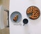 Piece of pie on plate with cup of tea on white table. Breakfast with tea and cake. Food photography. Table top photo. Tea time