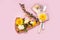 Piece pizza slice yellow pink background plug knife flower dandelion green yellow bouquet bunch tulip