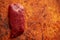 Piece of raw fresh beef steak placed on rusty background
