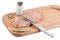 Piece raw pork, knife and spices on wooden board isolated