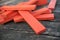 piece of red wooden brick of construction game on wo