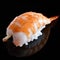A piece of shrimp nigiri sushi on black background