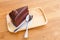 A piece of slice chocolate cake.