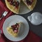 Piece, slice of homemade berry cake. Vegan delicious carrot and orange cake decorated with berries. Healthy dessert. Grey