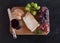 Piece of Spanish Blue cheese on an old wooden cutting board. Top view