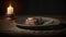 a piece of steak on a plate next to a lit candle on a wooden tablecloth with a candle holder in the background and a lit candle