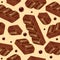 Pieces of aerated chocolate on a beidge background