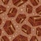 Pieces of aerated chocolate on a brown background