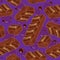 Pieces of aerated chocolate on a purple background