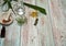 Pieces of aloe Vera, vodka, olive oil, apricot seed oil on a light wooden background.