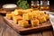 pieces of bbq cornbread arranged on a wooden tray