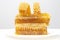 Pieces of beeswax honey on a white background