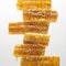 Pieces of beeswax honey on a white background