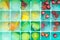 Pieces of berries, cucumbers and mangoes frozen in a silicone mold. Edible ice cubes close-up