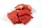 Pieces of bourguignon beef on a white background